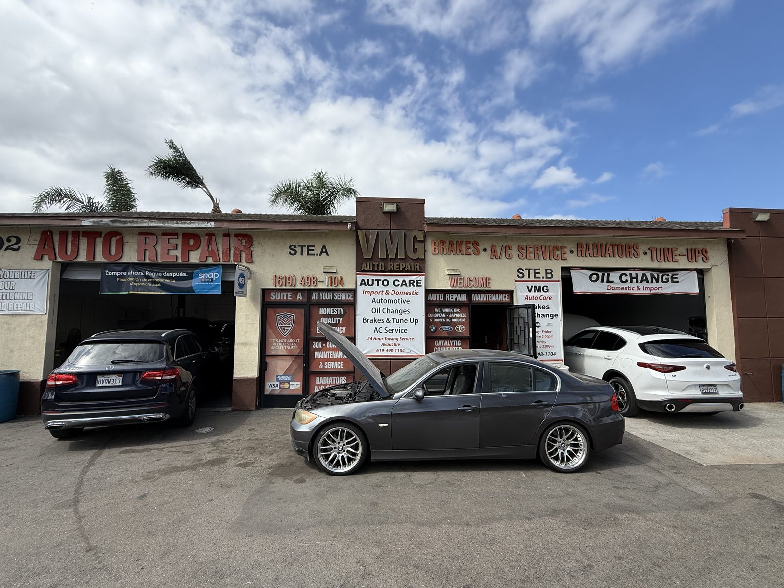 The VMG shop front with cars in the lot