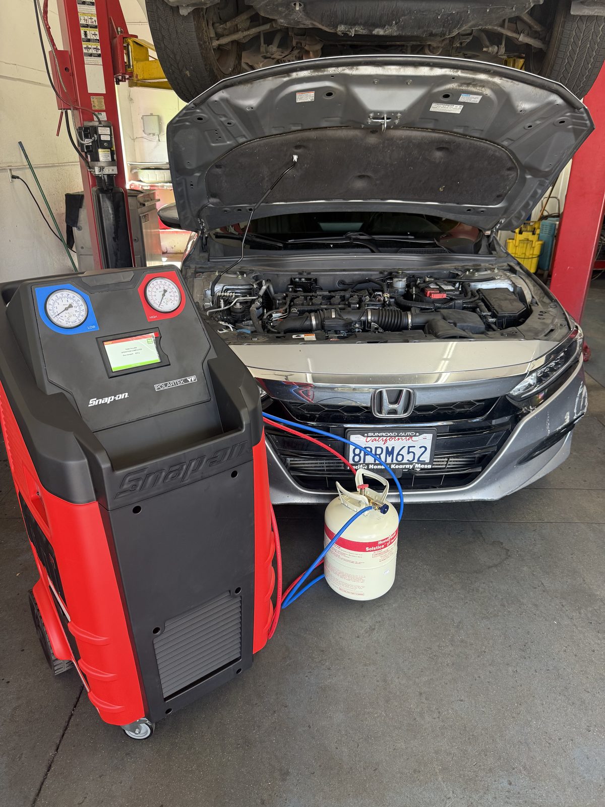 Honda hooked up to the A/C service machine